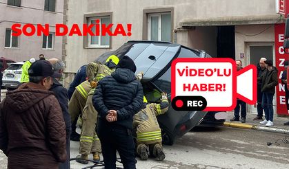 Bandırma'da ilginç kaza: Araç yan yattı, sürücü mahsur kaldı